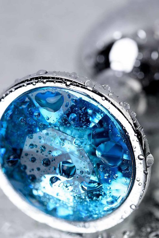 Silver anal plug TOYFA Metal,with a Topaz color gem