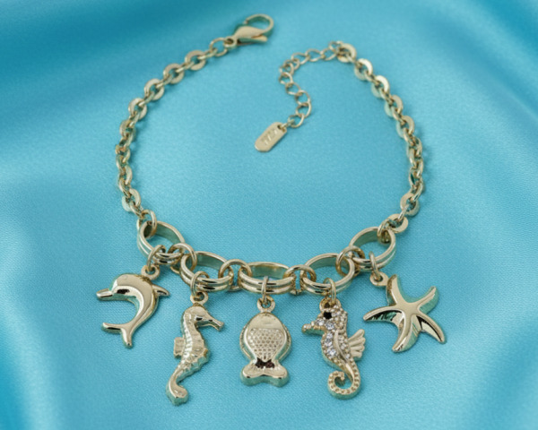 1879 Bransoletka elegancka złota 18+3cm pozłacana 14k konik morski rozgwiazda