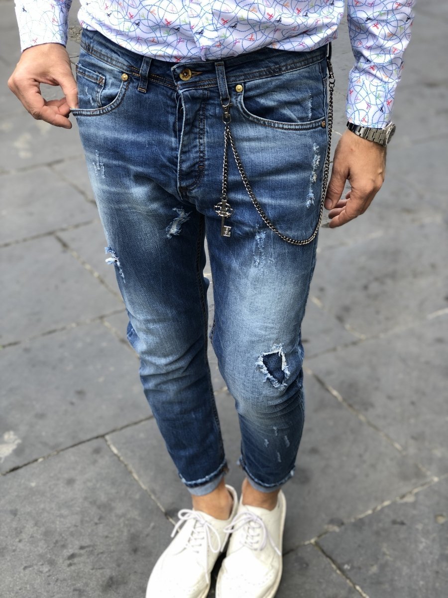 Jeans strappati con borchie Uomo jeans con strappi 