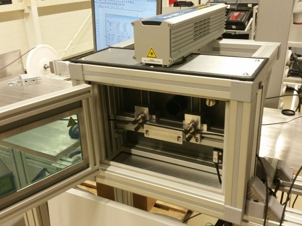 Laser cabinet for the use in cable marking