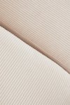 narożna sofa modułowa Fogler z lewym szezlongiem i pufą – beżowy sztruks, nowoczesny styl, 4 miejsca – Bellissima Casa
