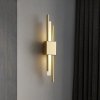 Designerska lampa na ścianę kinkiet metalowy złoty Sem Left