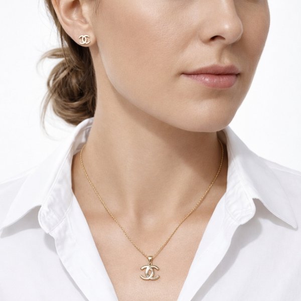 Komplet kolczyki i wisior splecione litery złoto 585