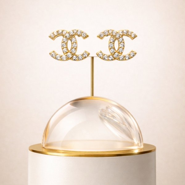 Kolczyki sztyft o splecionej formie z białymi kamieniami złoto 585 