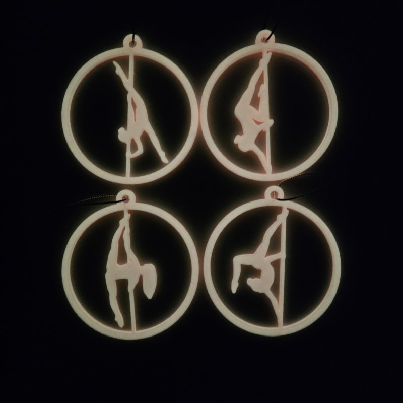 Set of 4 Pink Glow in the Dark Pole Dance Christmas Ornaments displayed together on a blue background. Amira Perun Poledance Decor.