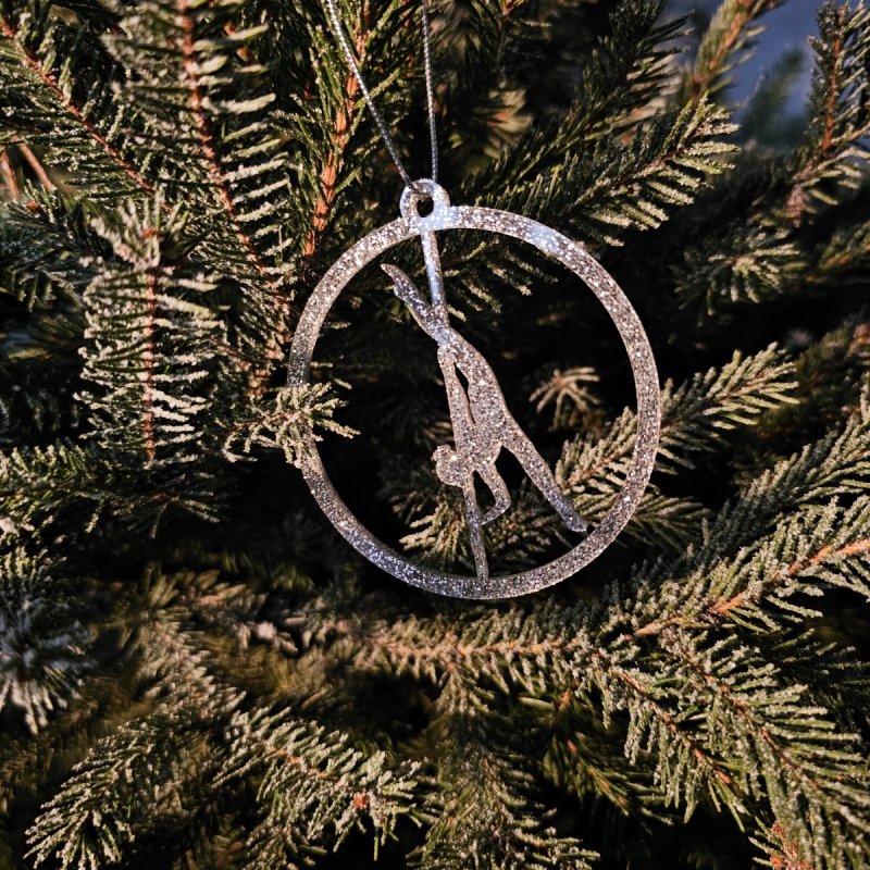 Silver Glitter Pole Dance Ornament Pose 1 hanging on a snowy Christmas tree branch