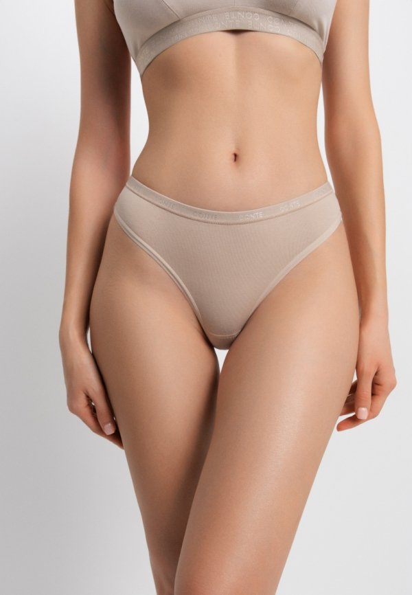 Stringi damskie CONTE COMFORT COTTON LST 5569 w kolorze naturalnym to połączenie wygody, miękkości i subtelnego stylu. Skład 92% bawełny i 8% elastanu zapewnia oddychalność, elastyczność i komfort noszenia.